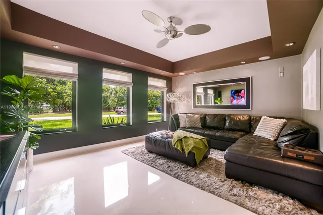 a living room with furniture and a large window