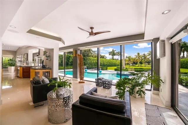 a living room with furniture and garden view