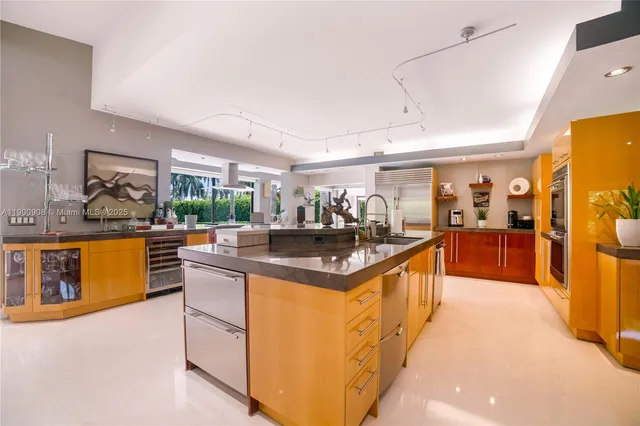 a kitchen with stainless steel appliances granite countertop lots of counter top space