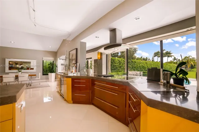 a kitchen with sink refrigerator and large window