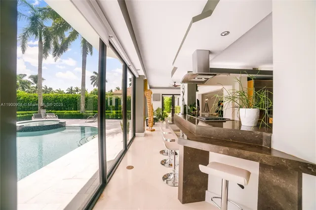 a kitchen with counter top space and living room