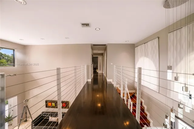 a view of a hallway with windows