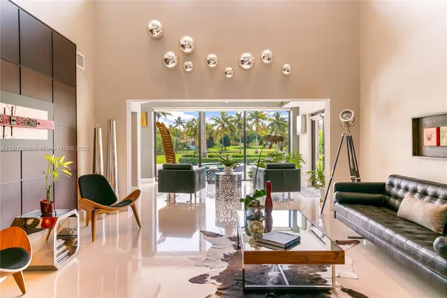 a dining room with wooden floor potted plant and windows