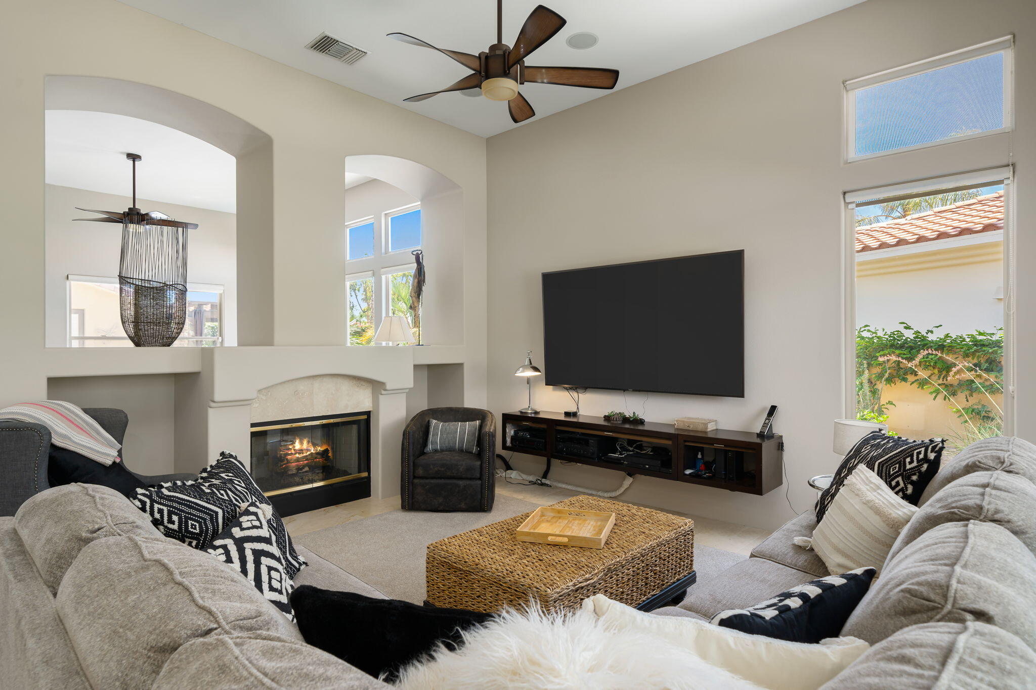 57355 Interlachen La Quinta, CA 92253 - Photo 14 of 35 a living room with furniture a flat screen tv and a fireplace
