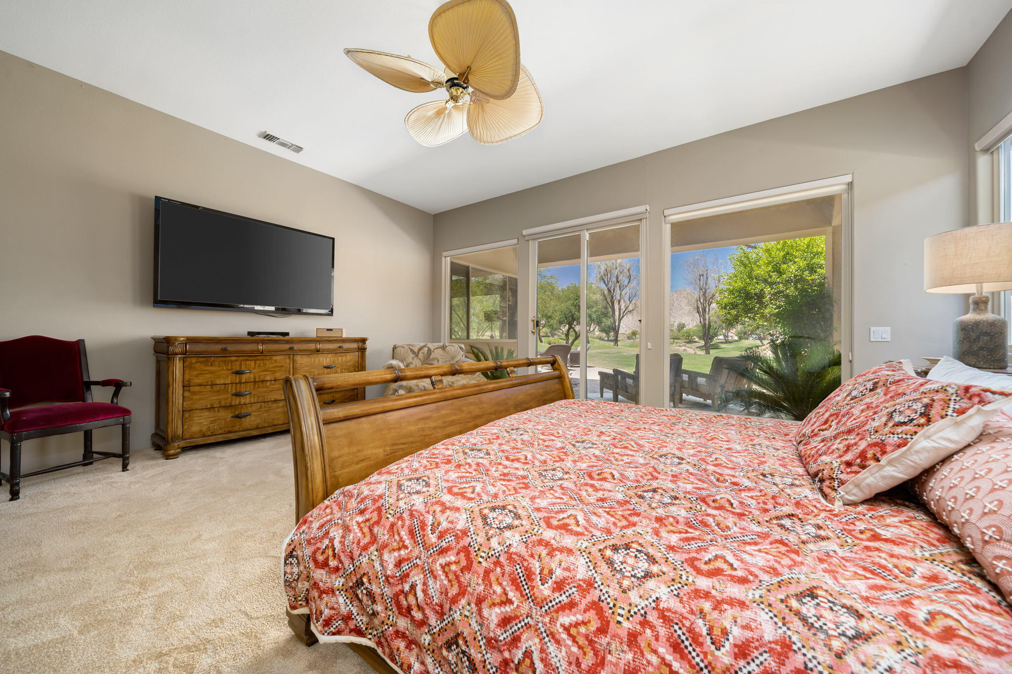 57355 Interlachen La Quinta, CA 92253 - Photo 17 of 35 a bedroom with a bed and a flat screen tv