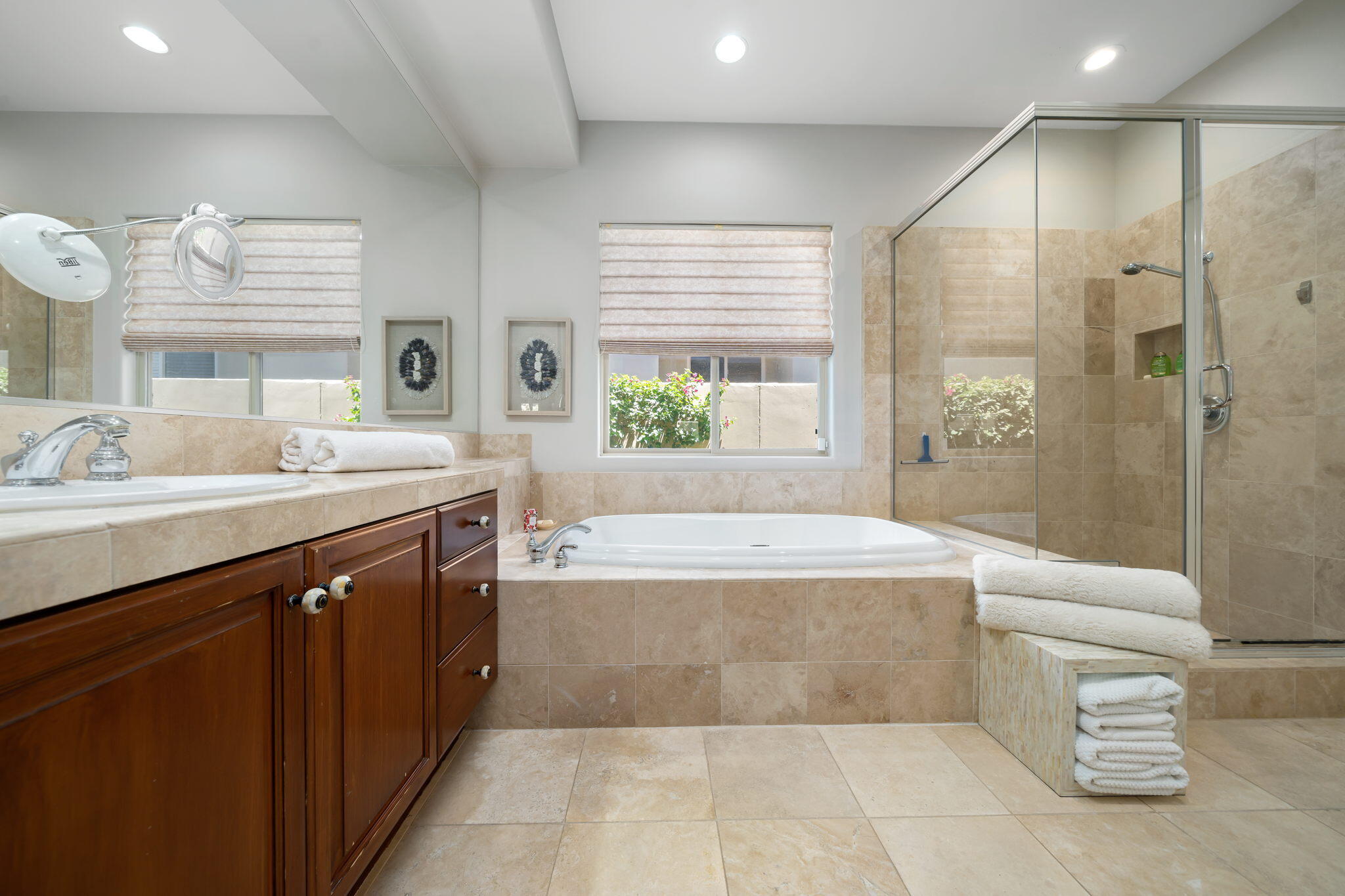 57355 Interlachen La Quinta, CA 92253 - Photo 18 of 35 a spacious bathroom with a double vanity sink large mirror and a bathtub