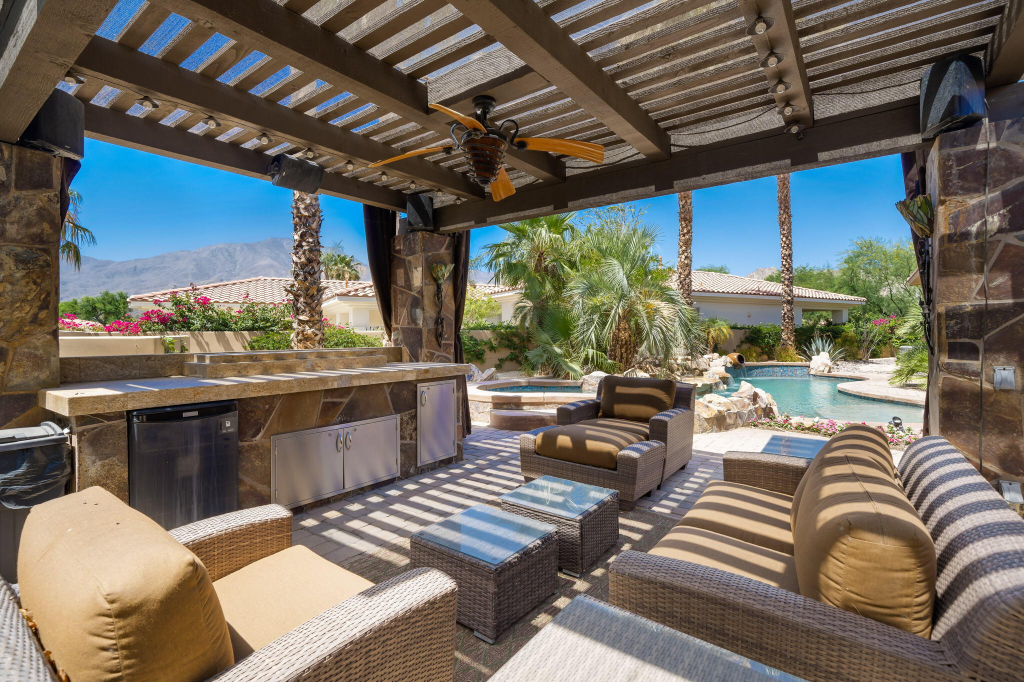 57355 Interlachen La Quinta, CA 92253 - Photo 2 of 35 a living room with patio furniture and a large window