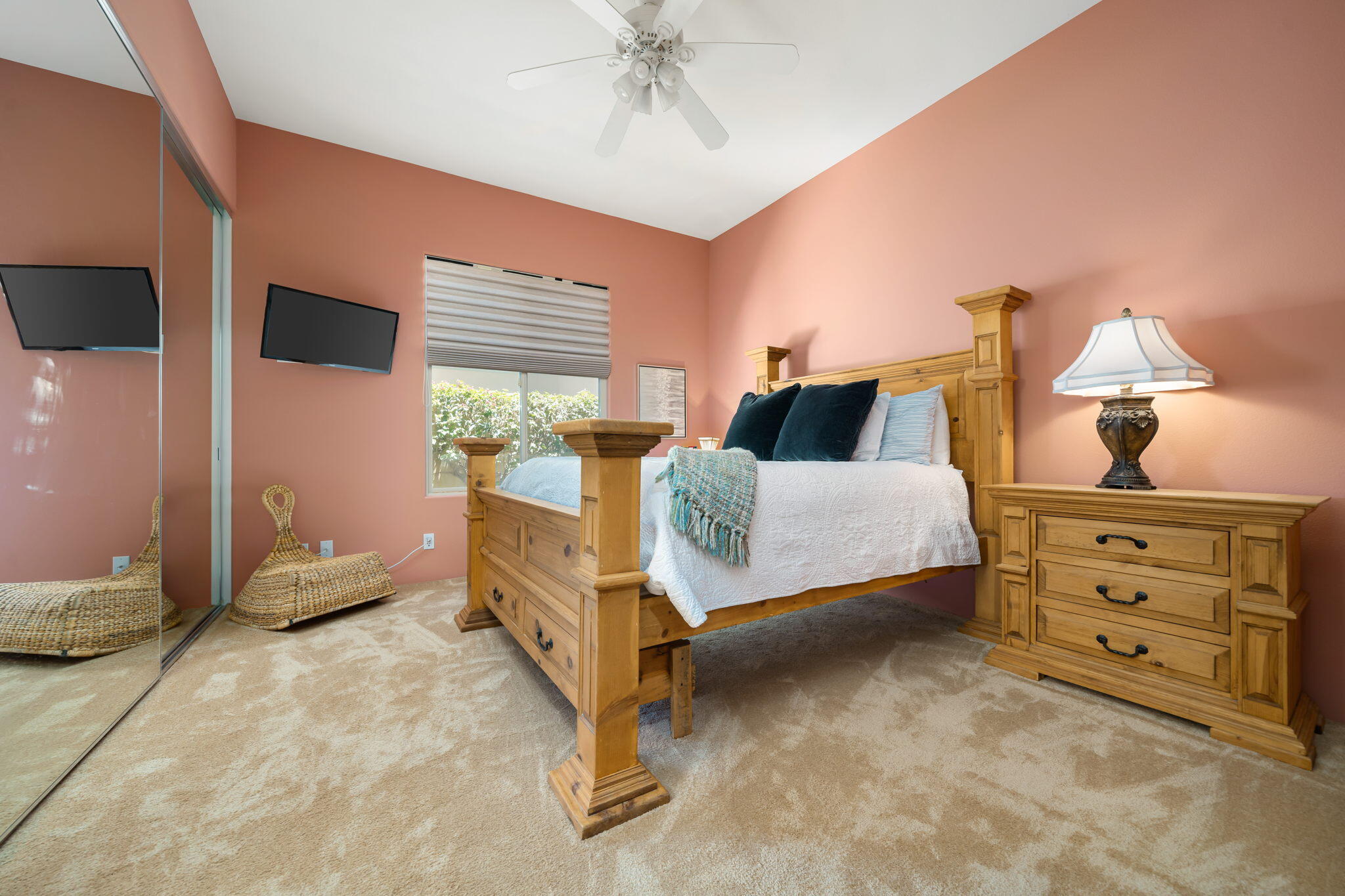57355 Interlachen La Quinta, CA 92253 - Photo 22 of 35 a bedroom with a bed and a dresser with mirror