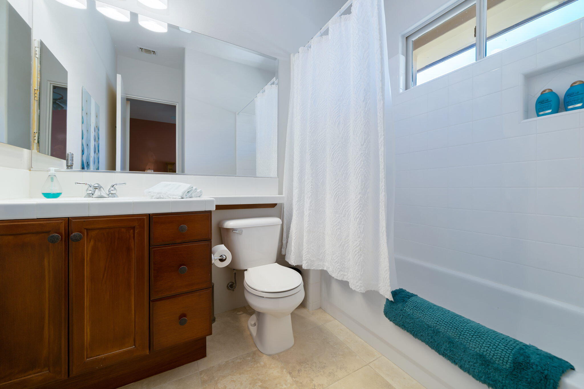 57355 Interlachen La Quinta, CA 92253 - Photo 23 of 35 a bathroom with a granite countertop toilet sink and mirror