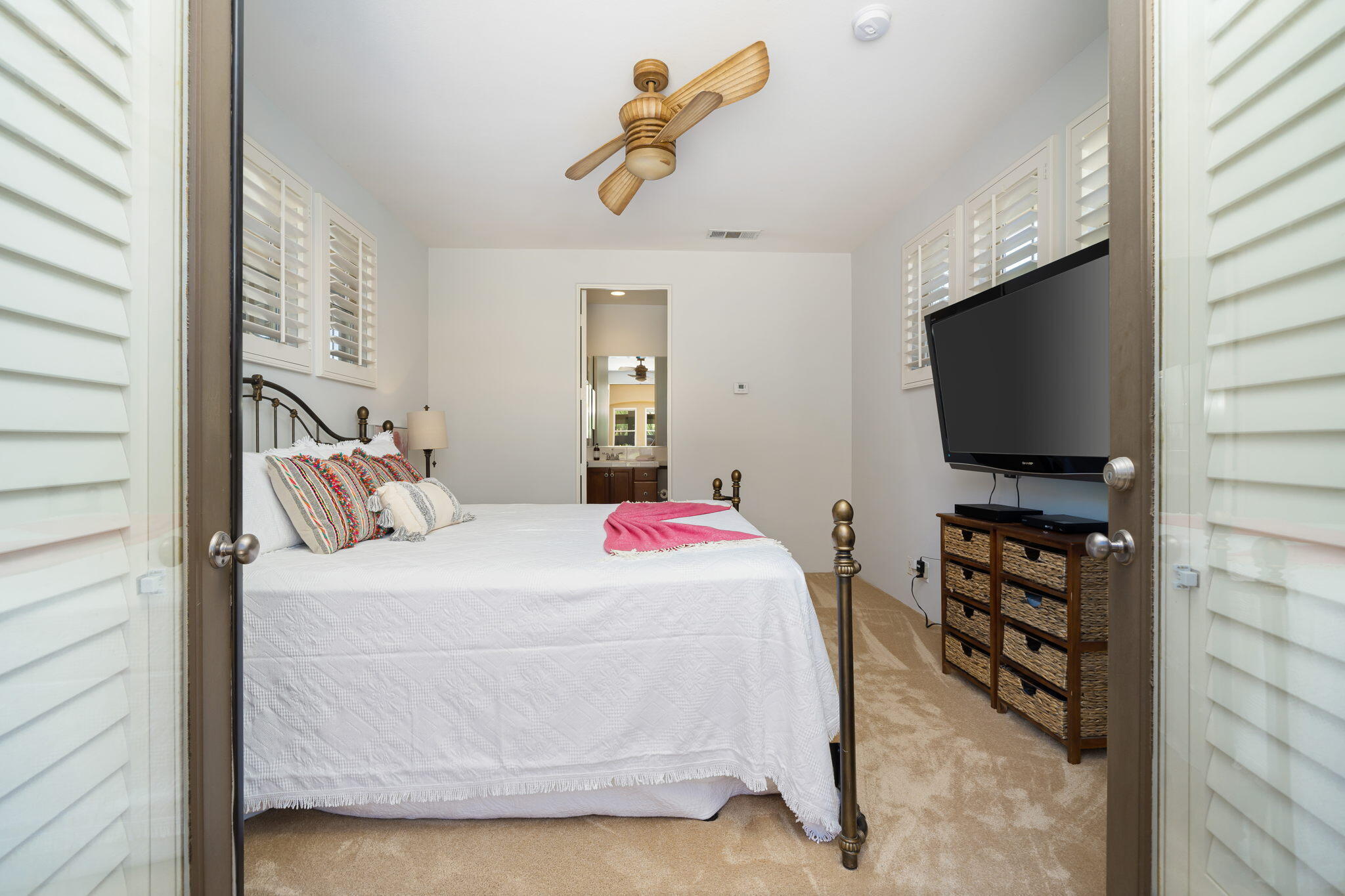 57355 Interlachen La Quinta, CA 92253 - Photo 24 of 35 a bedroom with a bed and a flat screen tv