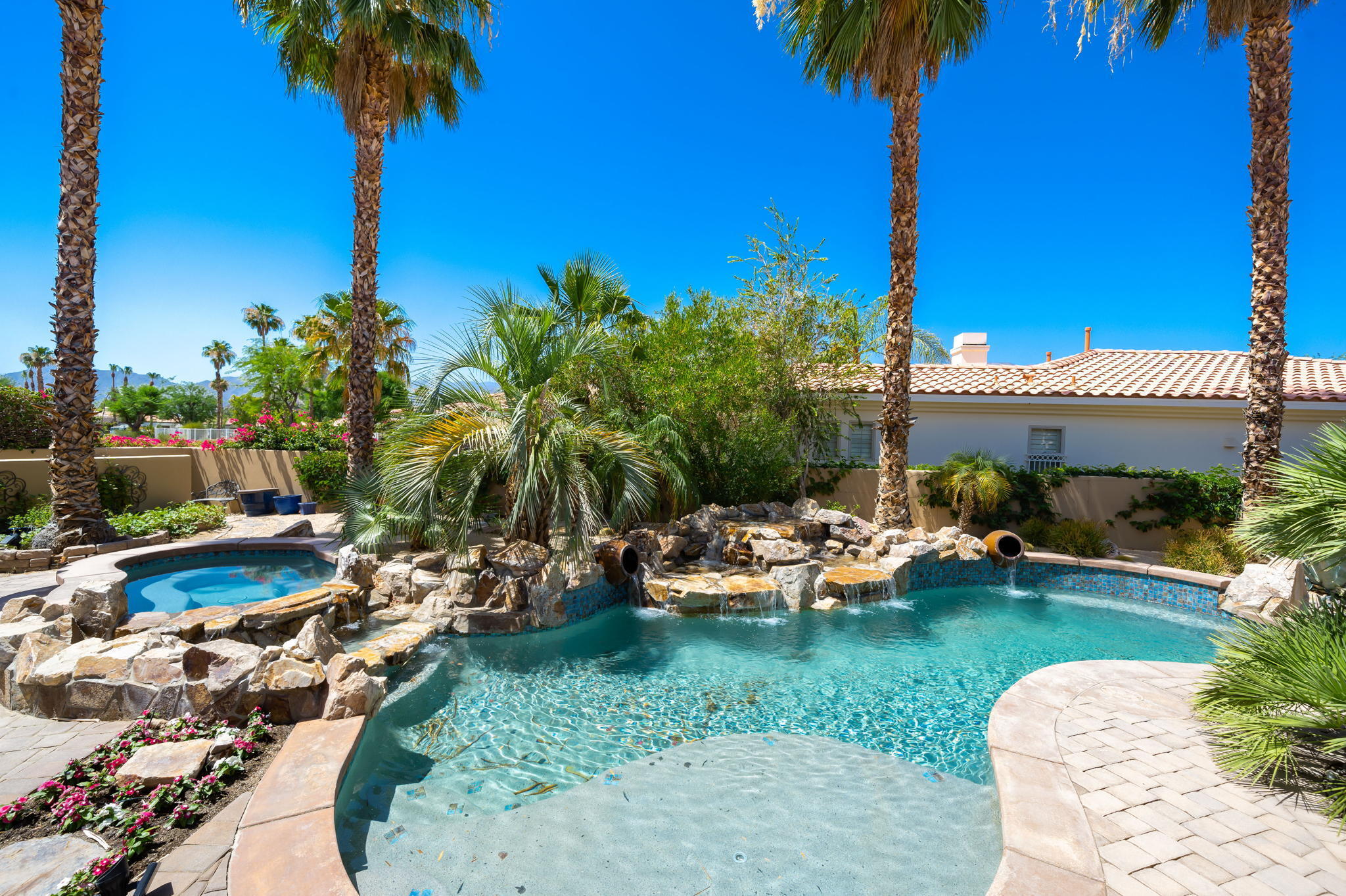 57355 Interlachen La Quinta, CA 92253 - Photo 27 of 35 a view of a backyard with plants and palm tree