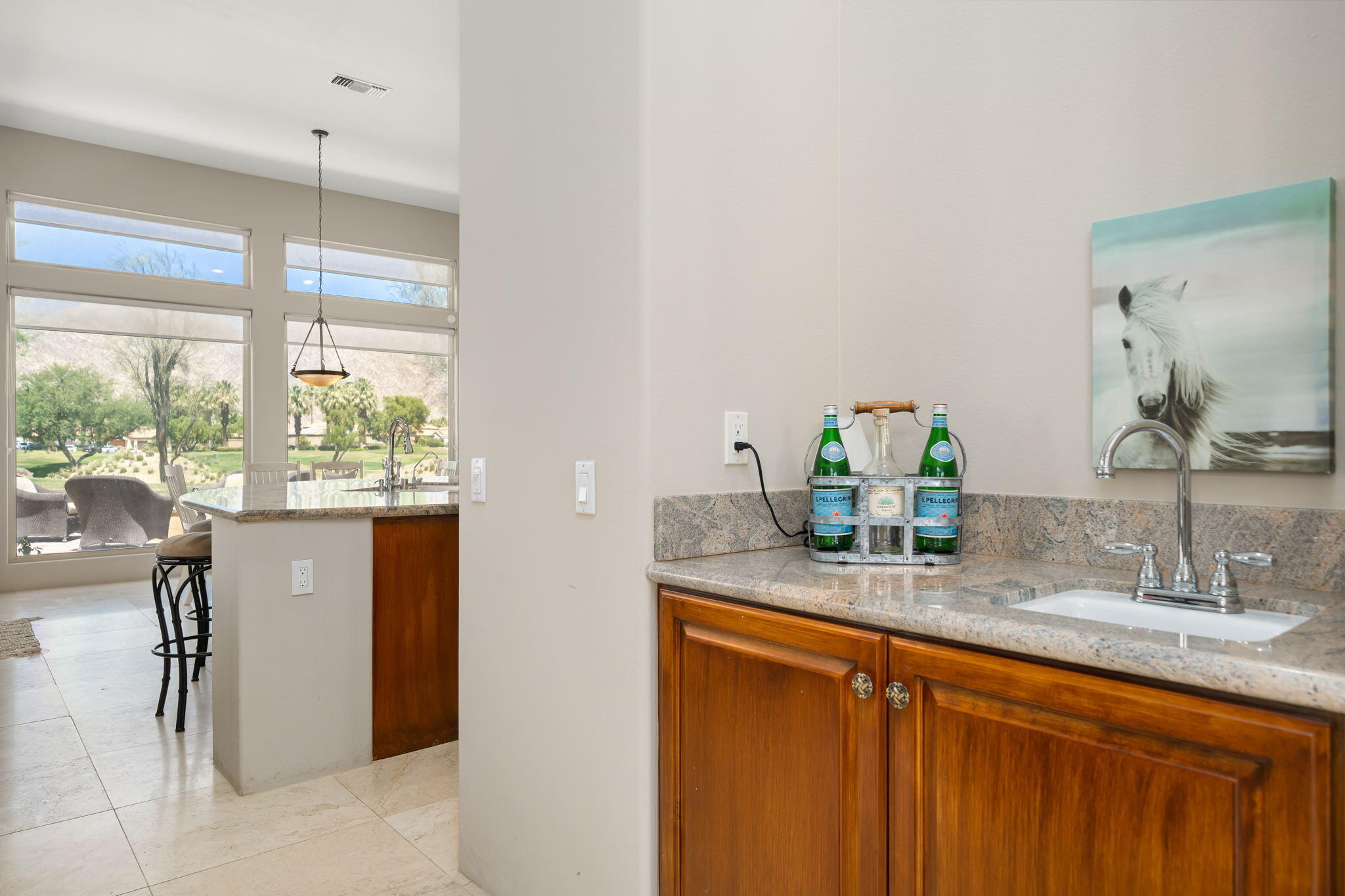 57355 Interlachen La Quinta, CA 92253 - Photo 7 of 35 a bathroom with a granite countertop sink and a mirror