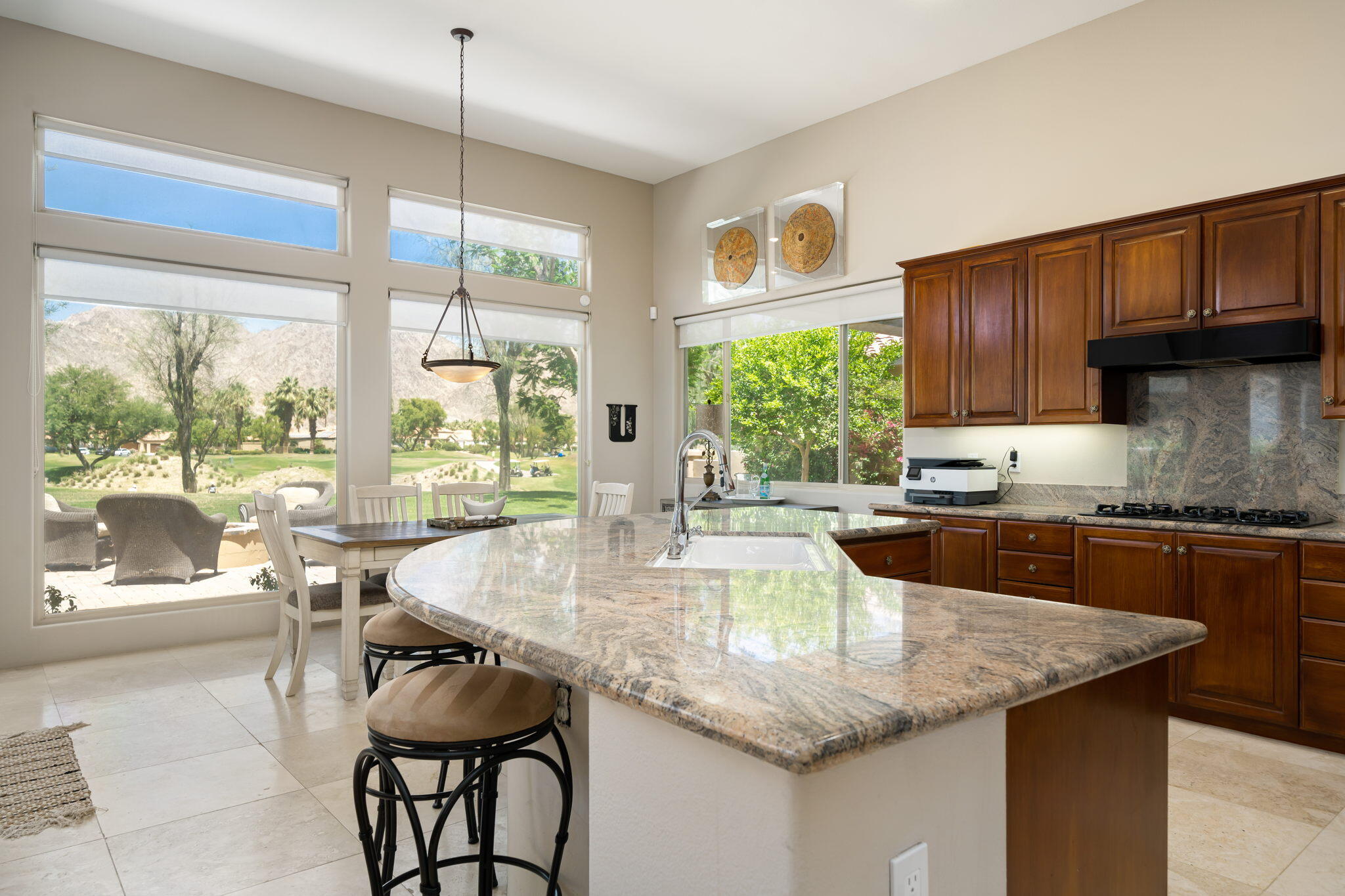 57355 Interlachen La Quinta, CA 92253 - Photo 9 of 35 a kitchen with granite countertop lots of counter top space and dining table