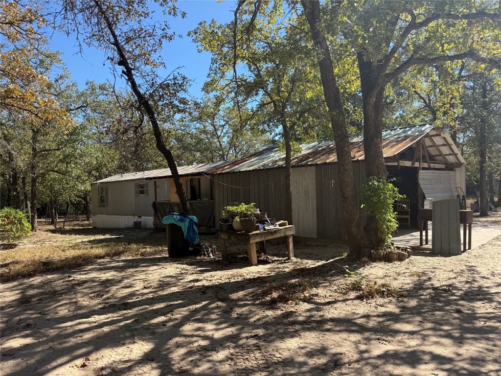 680 Hidden Oaks Drive Elgin, TX 78621 - Photo 3 of 6 a view of a house with backyard of snow and furniture