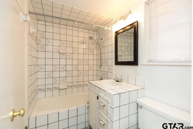 a bathroom with a sink and a bathtub