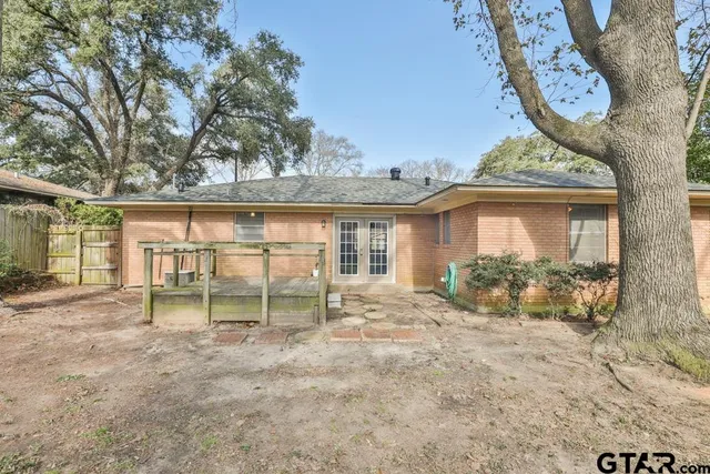 a view of a house with large windows