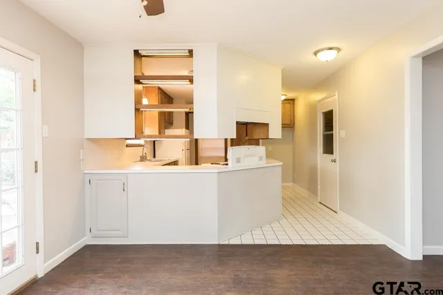 a room with sink and mirror