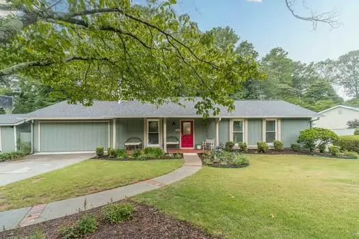 a front view of a house with garden