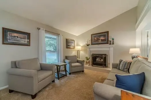 a view of living room filled with furniture and window