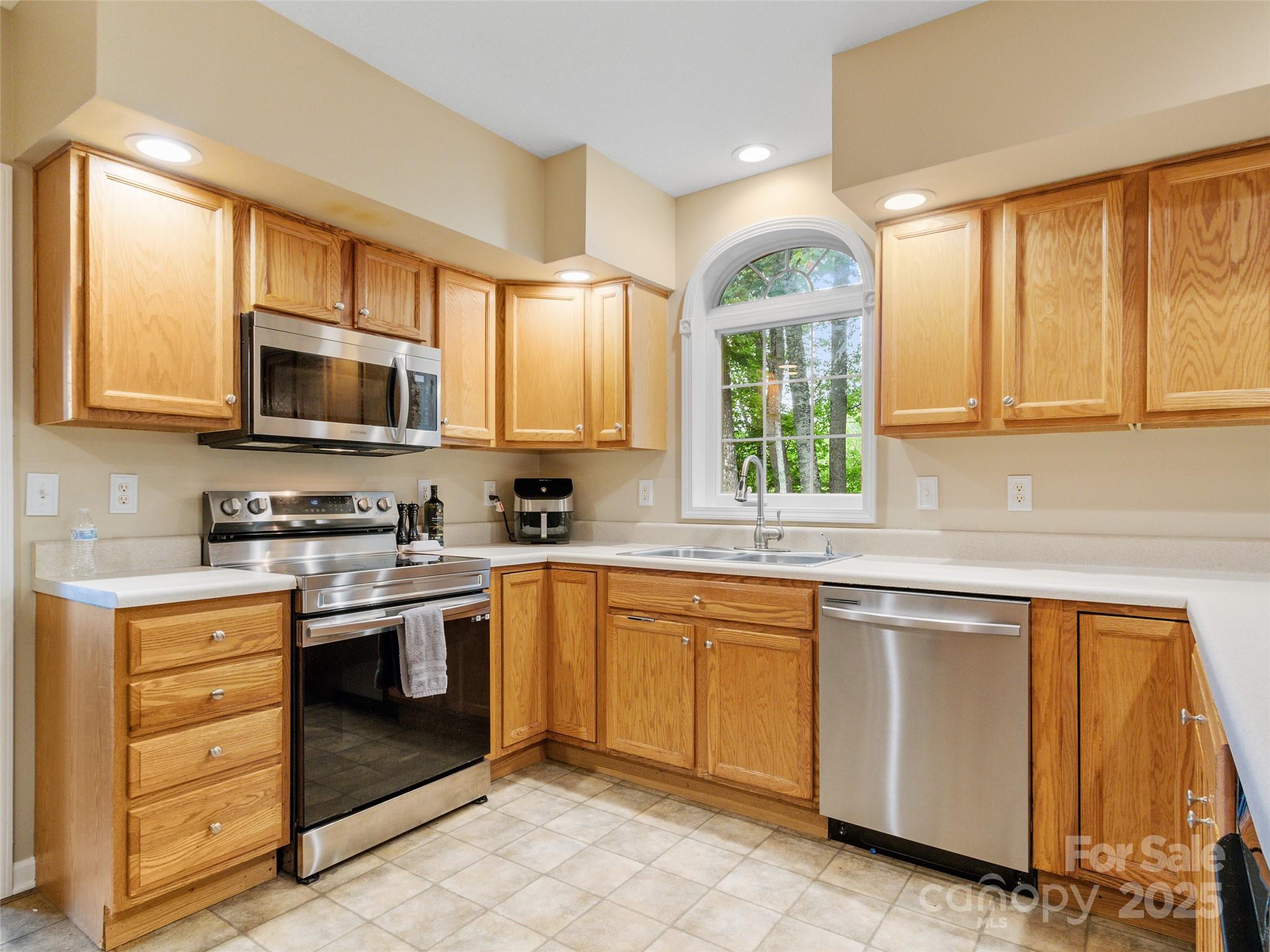 161 Blue Rock Road Burnsville, NC 28714 - Photo 12 of 48 a kitchen with a sink stove and microwave