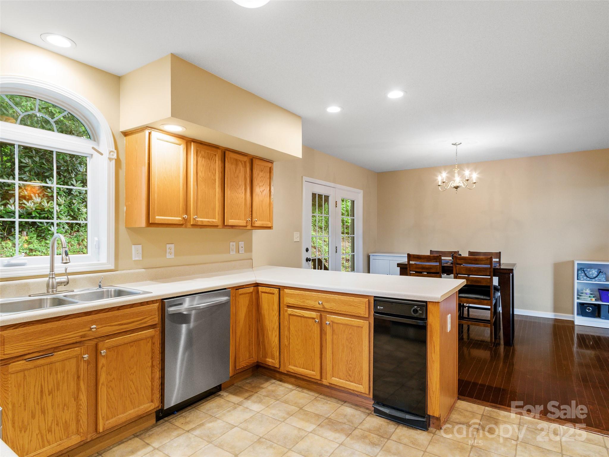 161 Blue Rock Road Burnsville, NC 28714 - Photo 13 of 48 a kitchen with a sink stove and cabinets