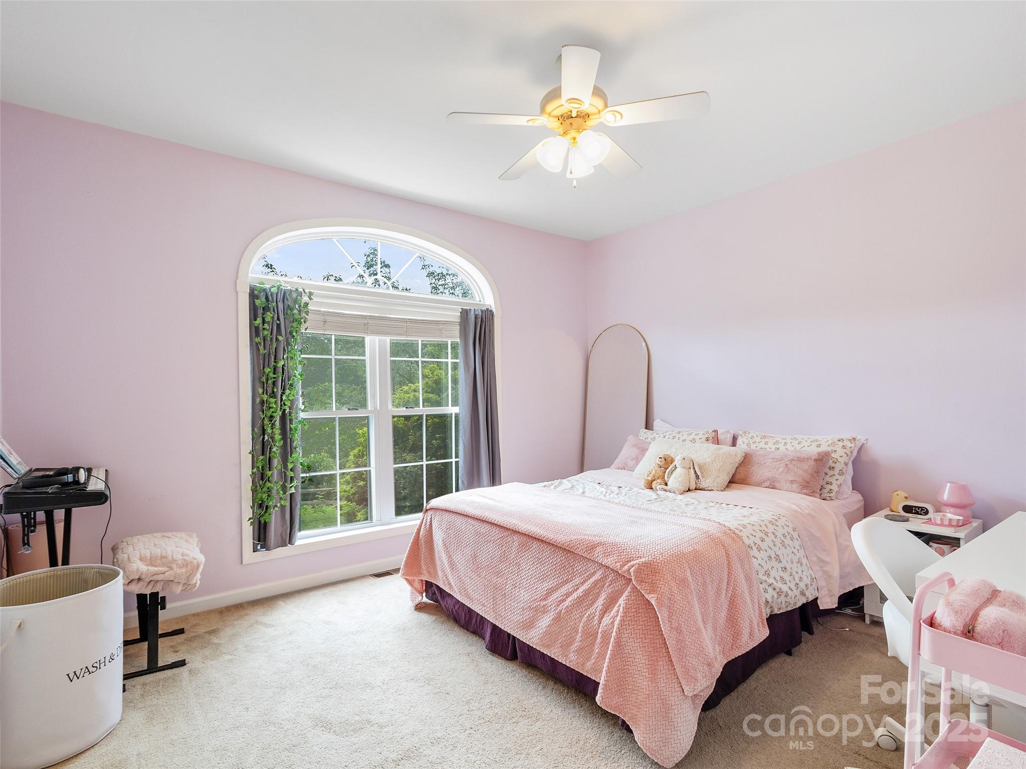 161 Blue Rock Road Burnsville, NC 28714 - Photo 27 of 48 a bedroom with a bed and a large window