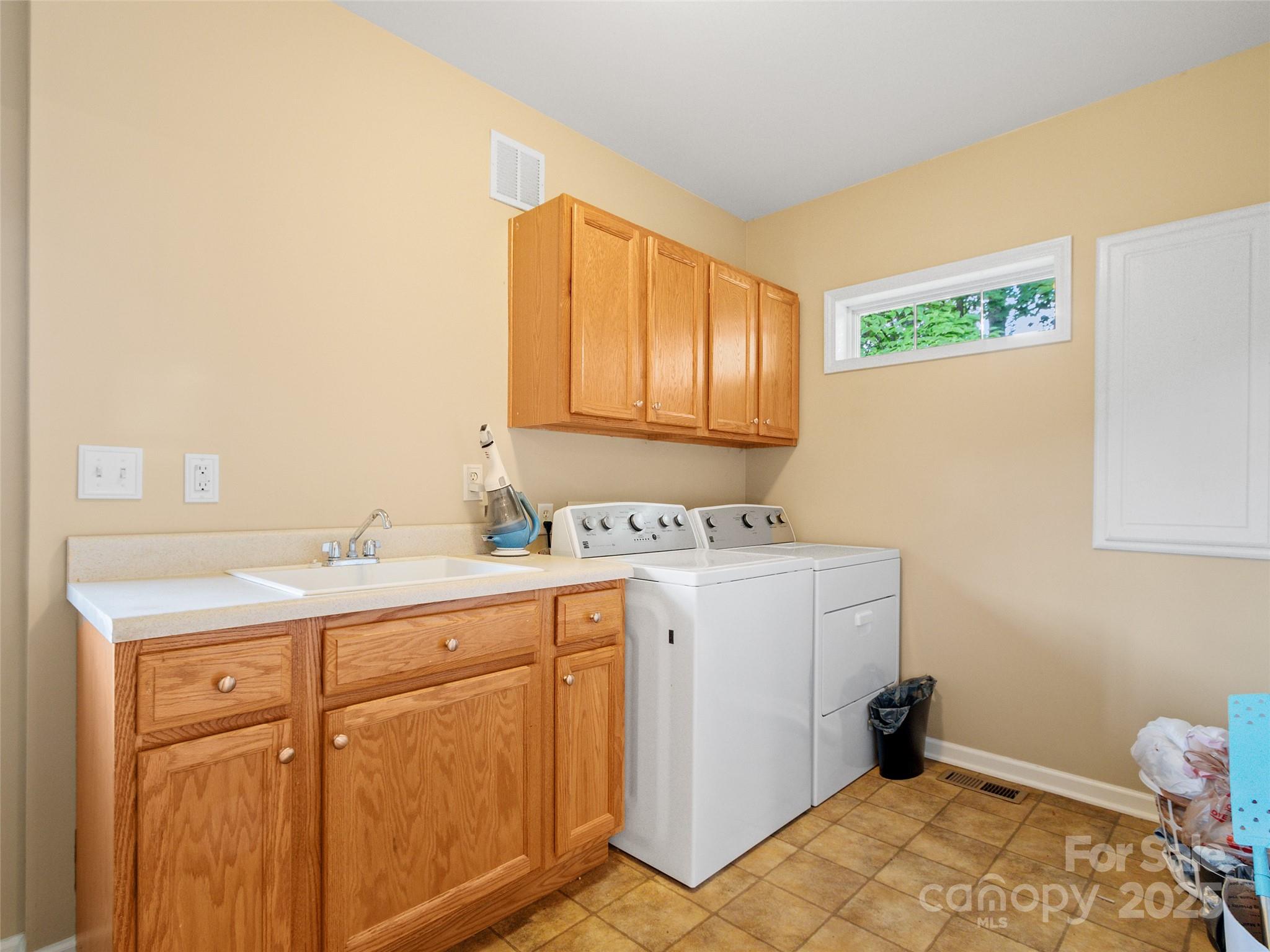 161 Blue Rock Road Burnsville, NC 28714 - Photo 32 of 48 a room with a sink a stove and a window