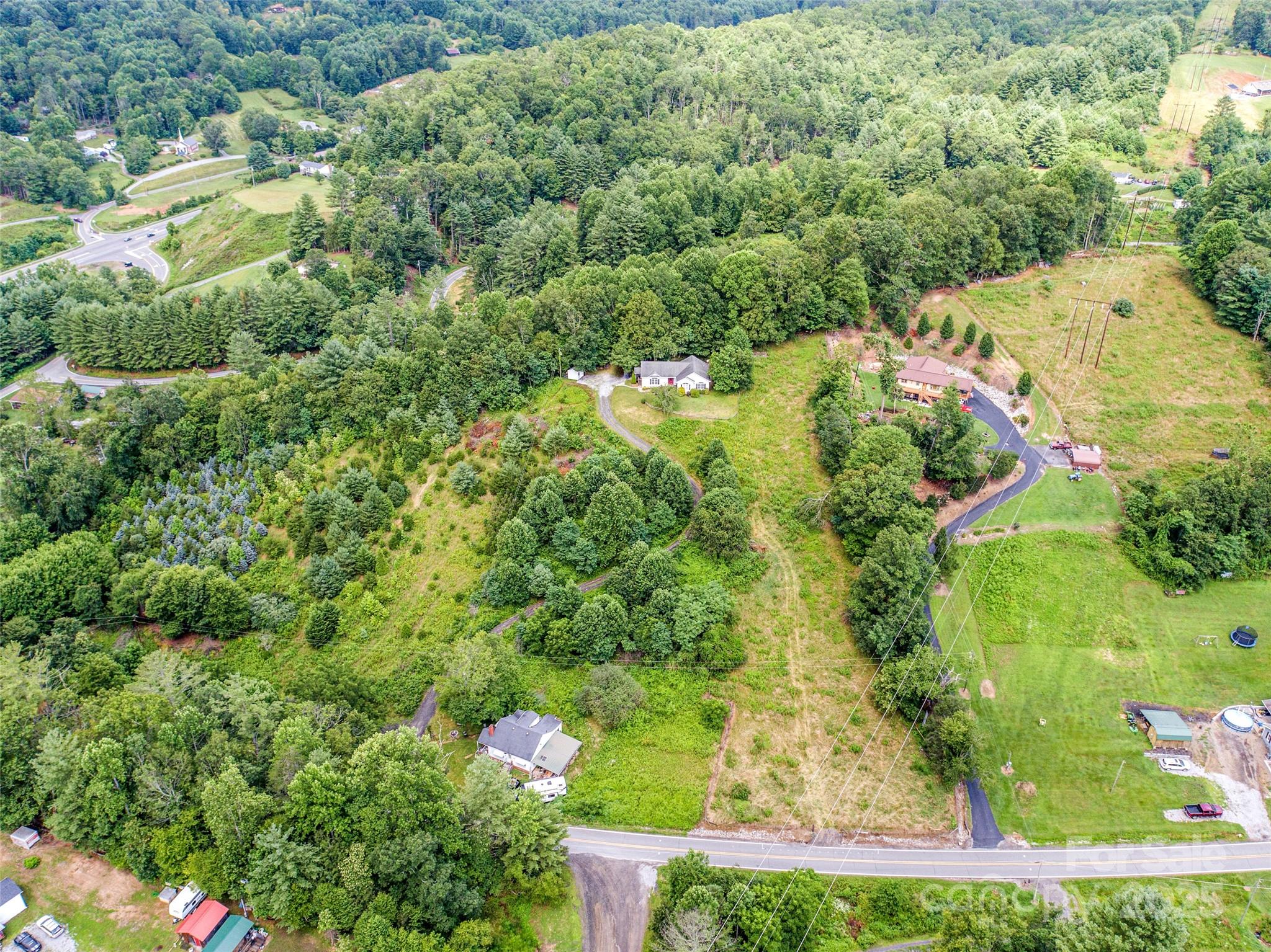 161 Blue Rock Road Burnsville, NC 28714 - Photo 40 of 48 an aerial view of residential house with outdoor space and trees all around