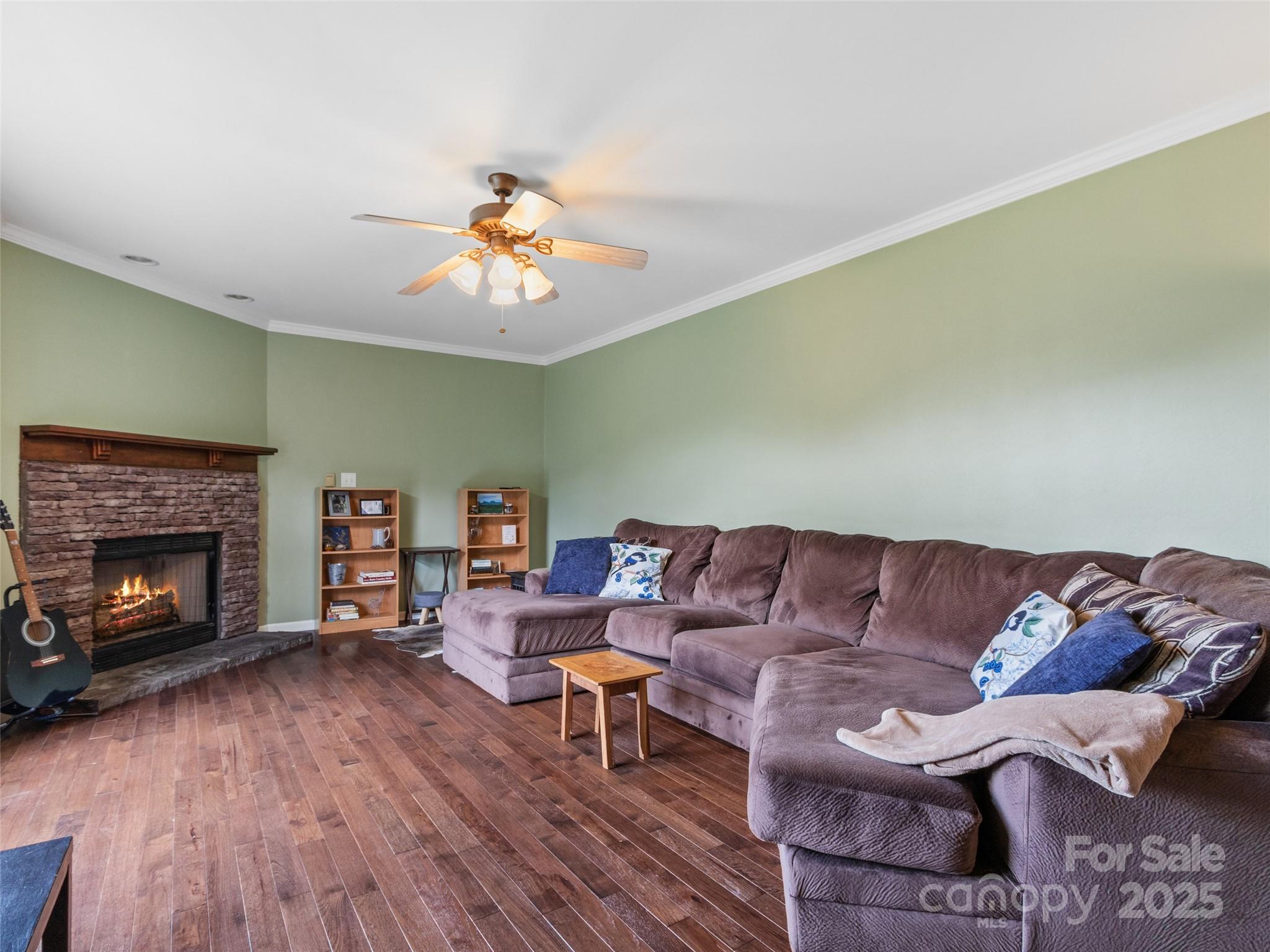 161 Blue Rock Road Burnsville, NC 28714 - Photo 7 of 48 a living room with furniture and a fireplace
