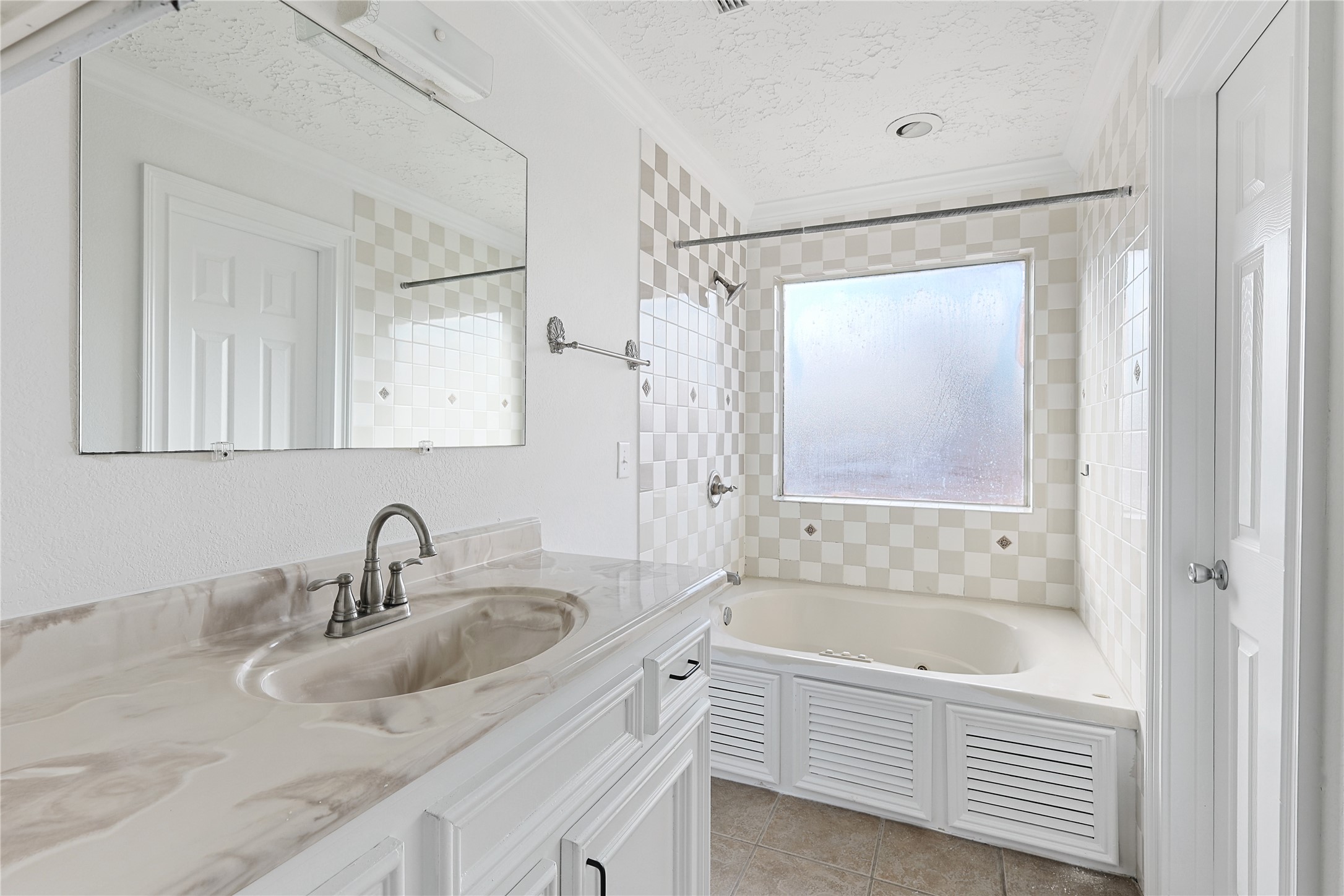 8502 Detroit Street, Unit C Houston, TX 77017 - Photo 15 of 15 a bathroom with a tub sink and mirror