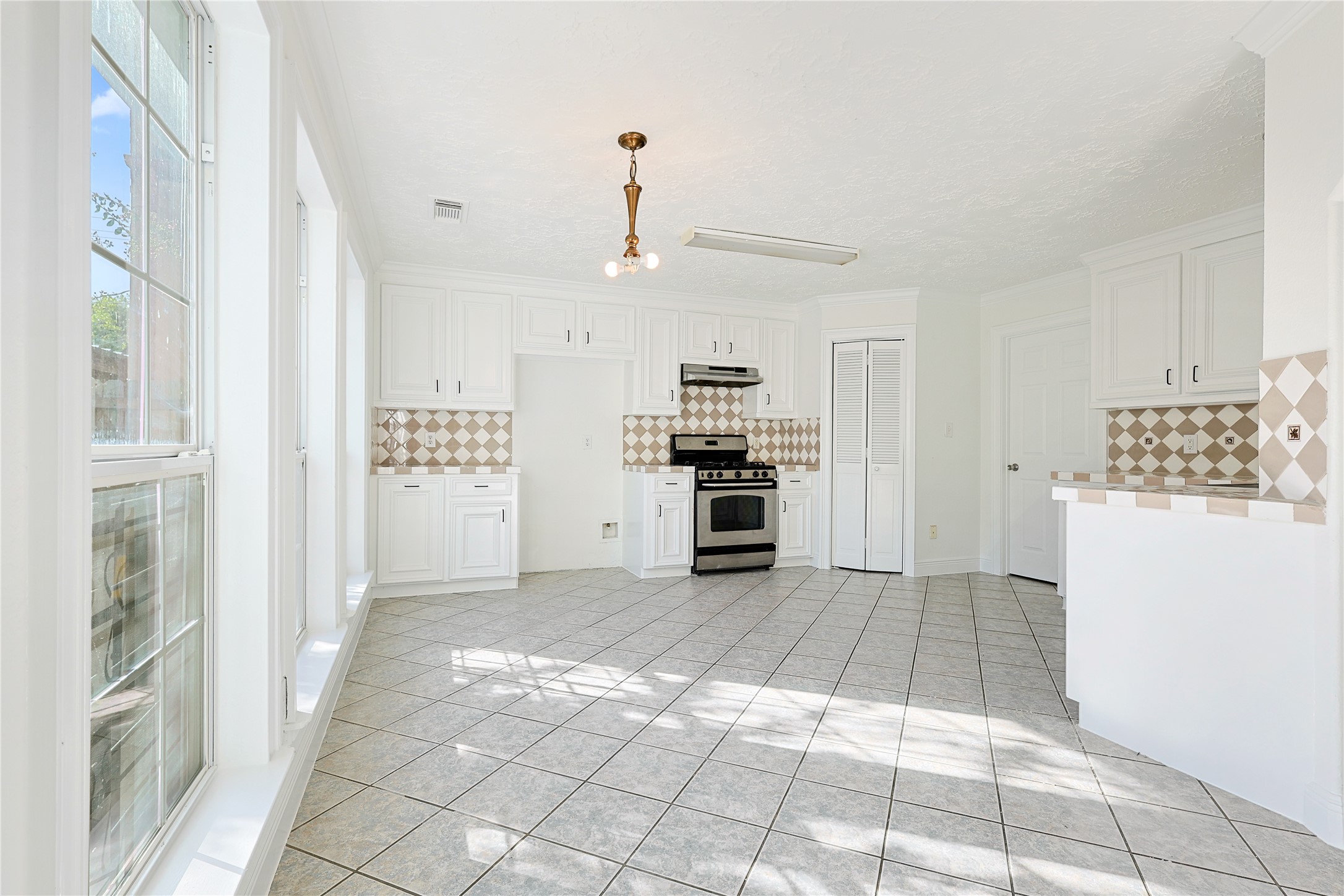 8502 Detroit Street, Unit C Houston, TX 77017 - Photo 6 of 15 a view of wooden floor and windows in a kitchen