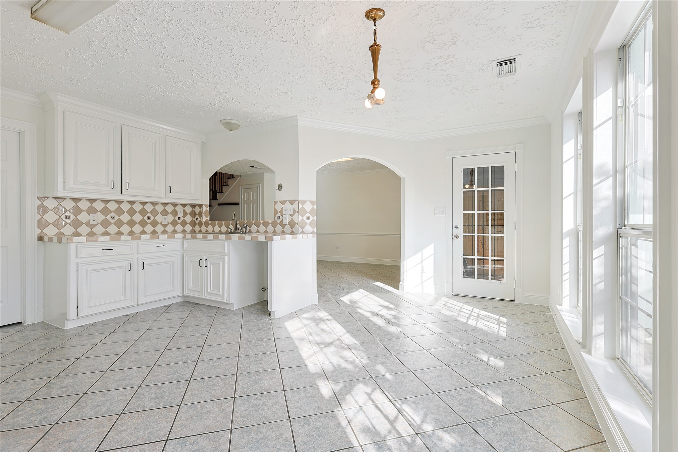 8502 Detroit Street, Unit C Houston, TX 77017 - Photo 8 of 15 a view of a kitchen with a sink dishwasher and cabinets