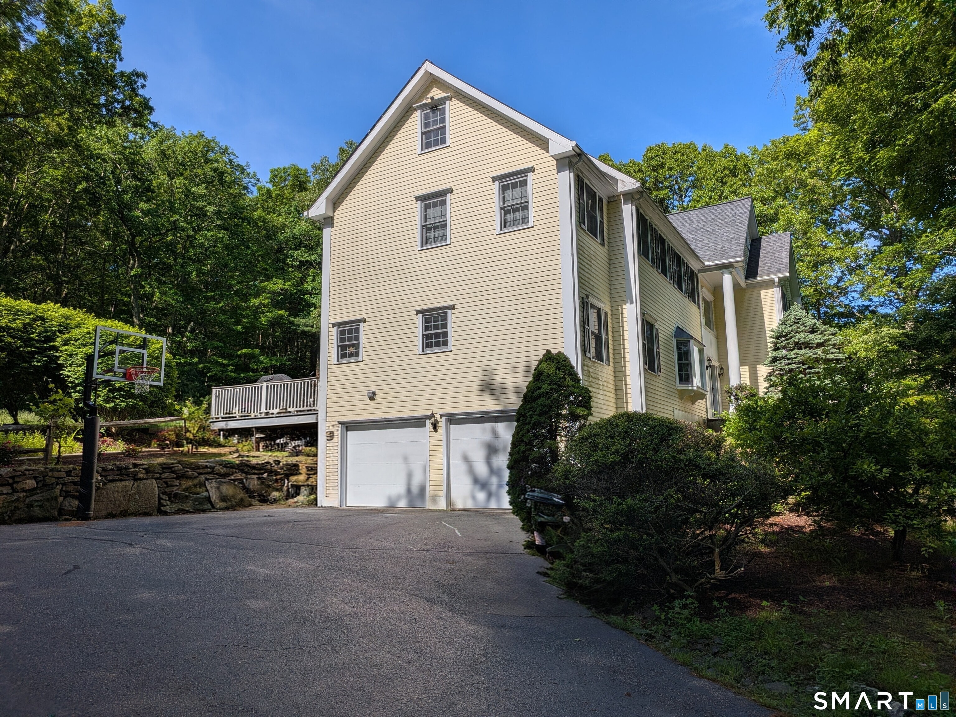 12 Carriage Hill Road Woodbridge, CT 06525 - Photo 2 of 24 a view of a house with a street