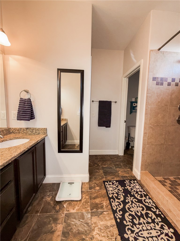 2409 Watkins Road Anderson, SC 29625 - Photo 25 of 44 This primary bathroom features spacious countertops and a tiled shower for ultimate relaxation.