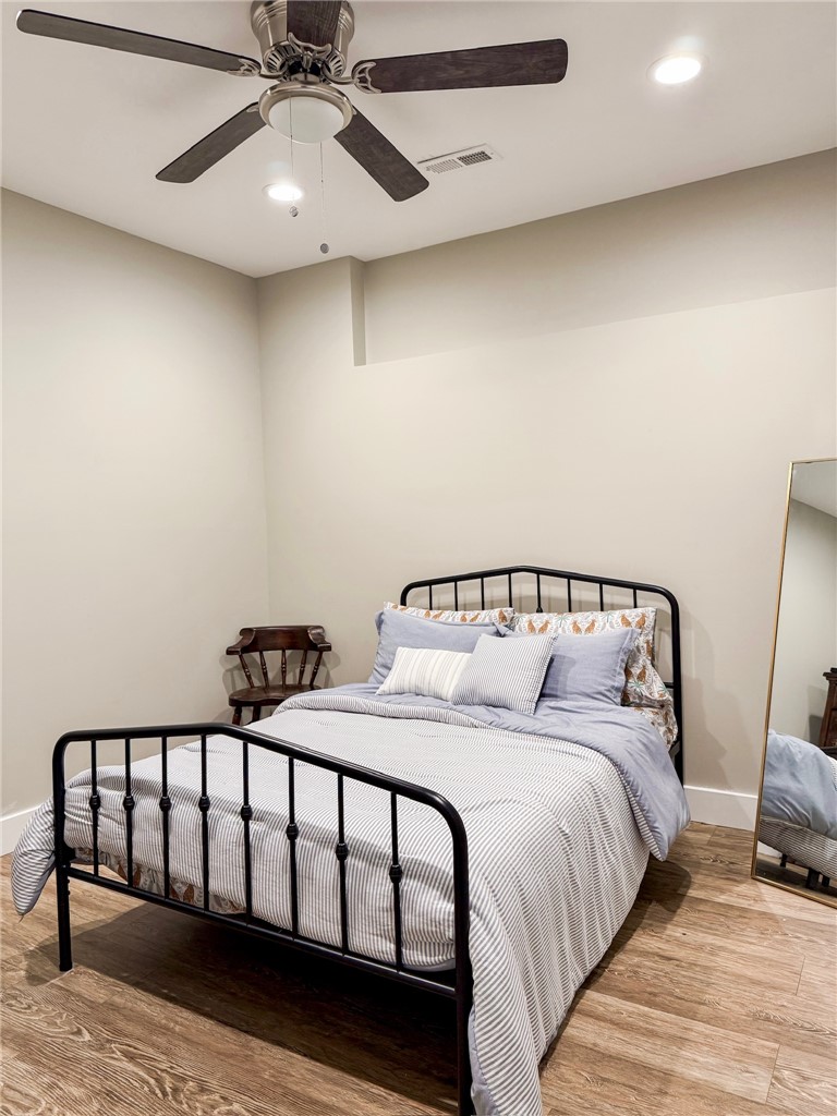 2409 Watkins Road Anderson, SC 29625 - Photo 40 of 44 This inviting Basement bedroom features rich hardwood flooring and convenient ceiling fan for ultimate comfort.