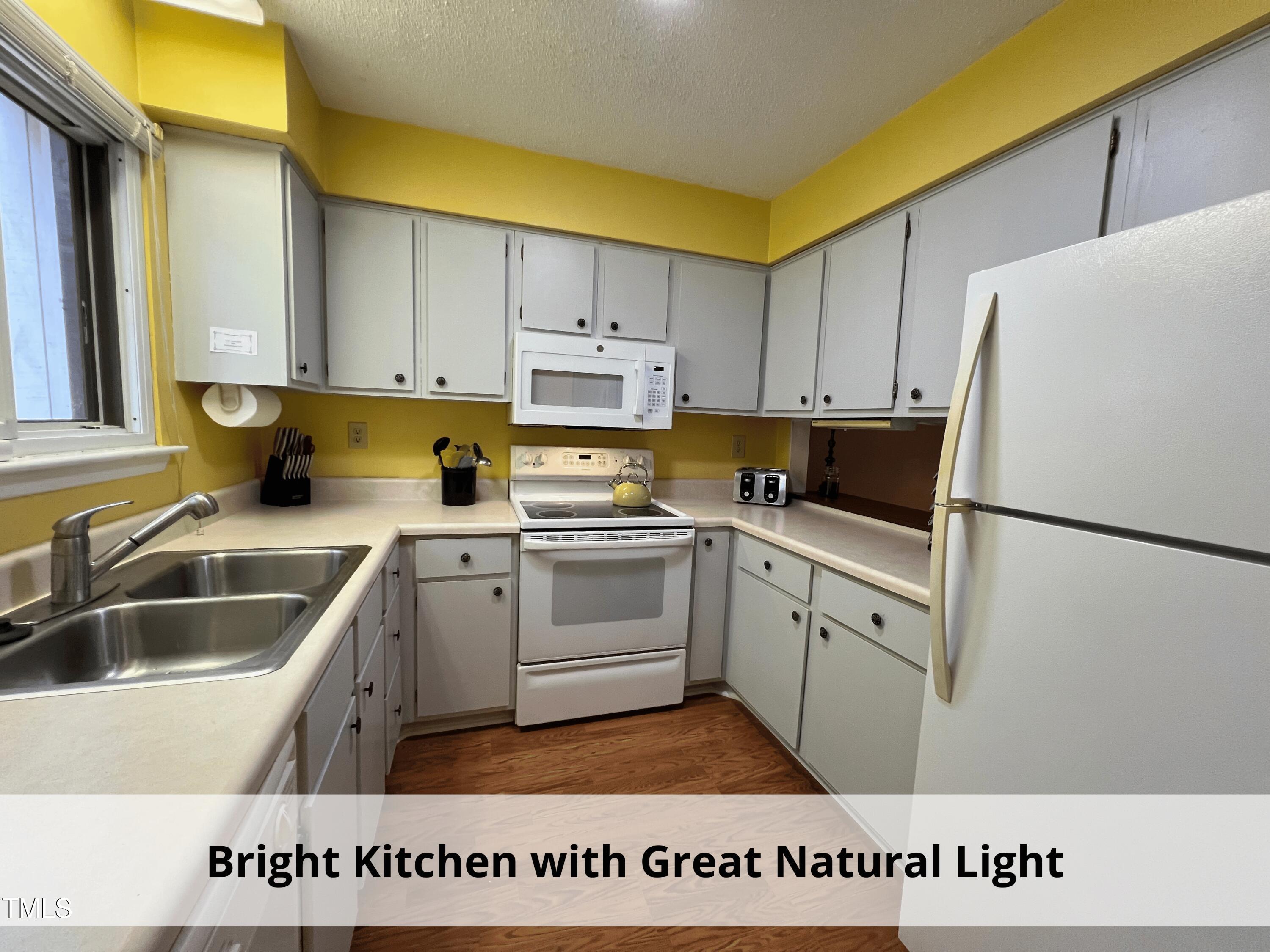 3775 Guess Road, Unit 43 Durham, NC 27705 - Photo 13 of 34 a kitchen with a refrigerator sink and cabinets