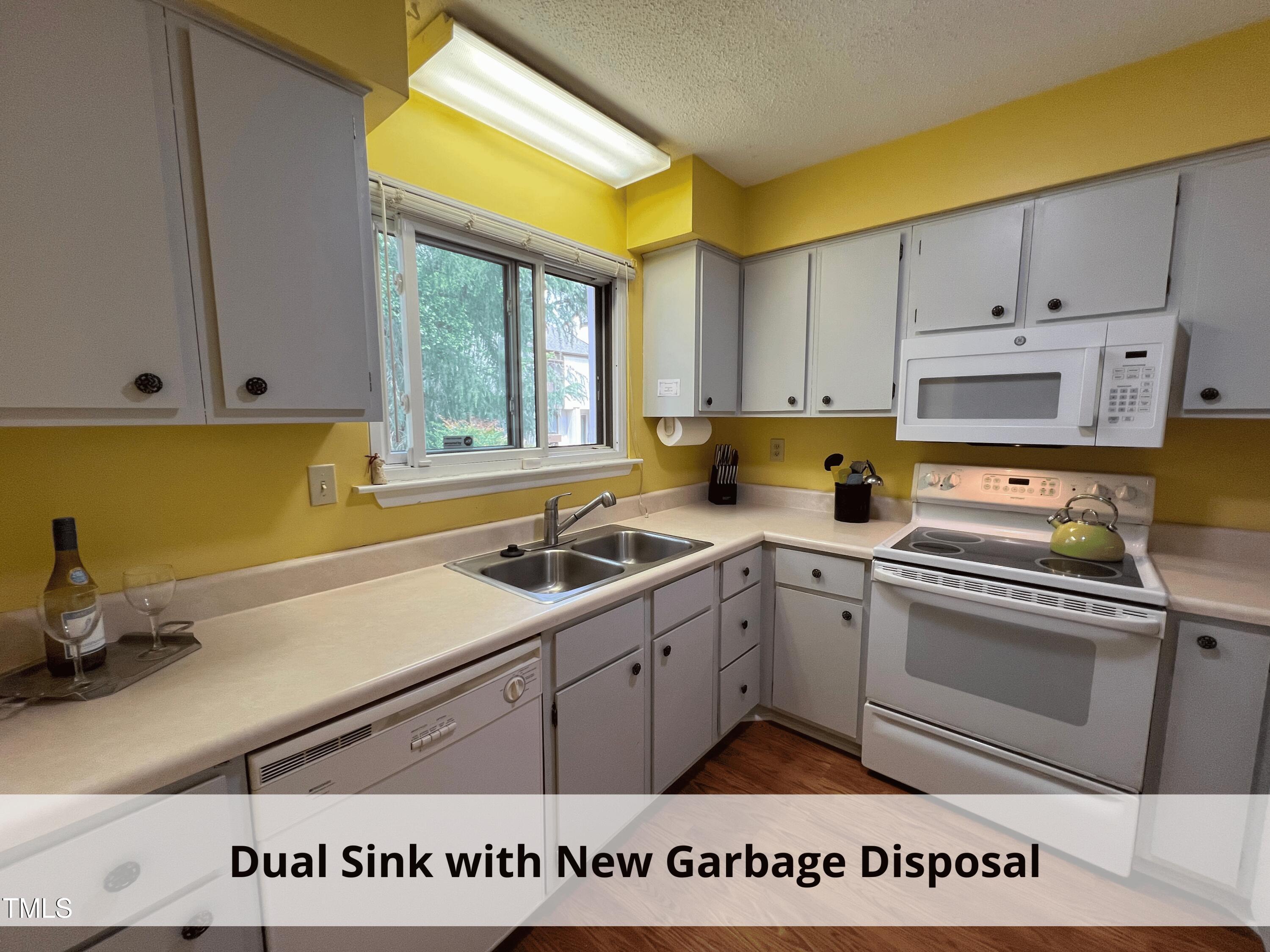 3775 Guess Road, Unit 43 Durham, NC 27705 - Photo 14 of 34 a kitchen with a sink cabinets and window