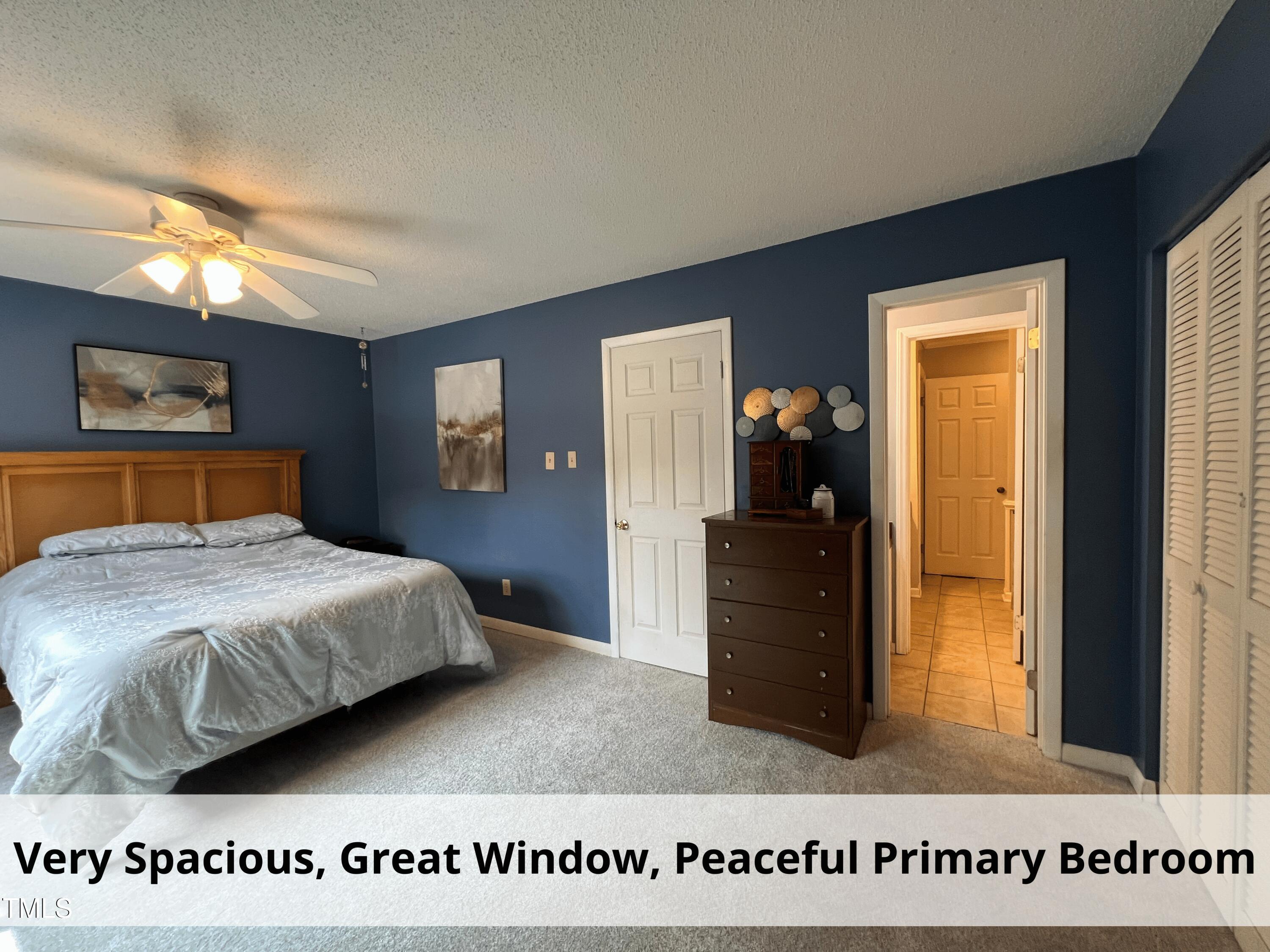 3775 Guess Road, Unit 43 Durham, NC 27705 - Photo 17 of 34 a bedroom with a large bed and a dresser