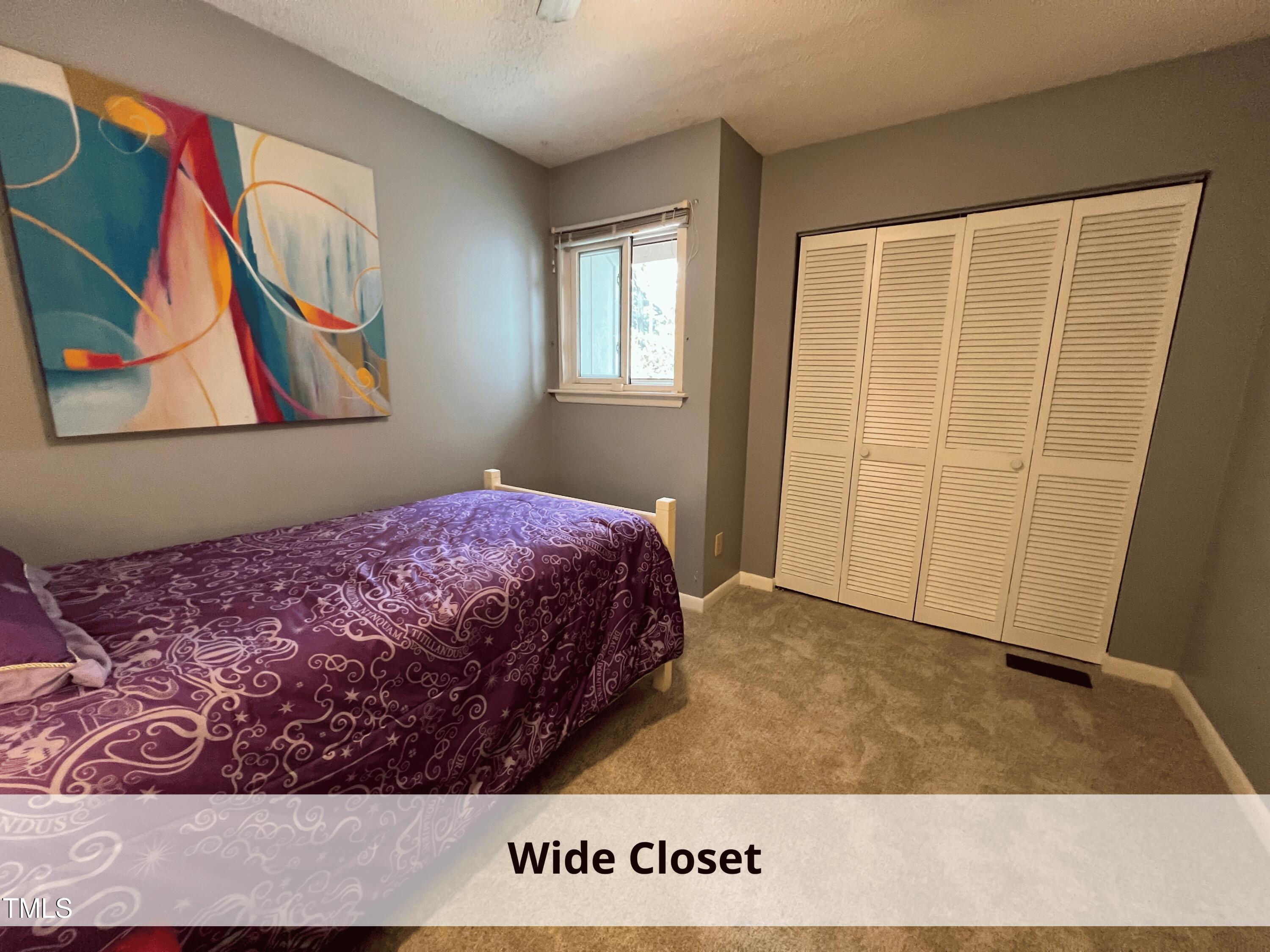 3775 Guess Road, Unit 43 Durham, NC 27705 - Photo 24 of 34 a bedroom with a bed in it