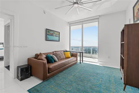 a hallway with mirror and window