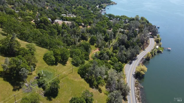 a view of a lake in middle of forest