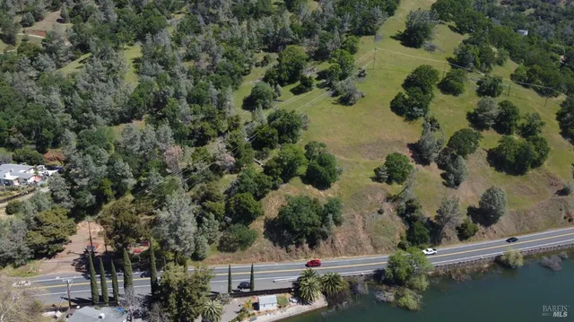 an aerial view of a house with a yard