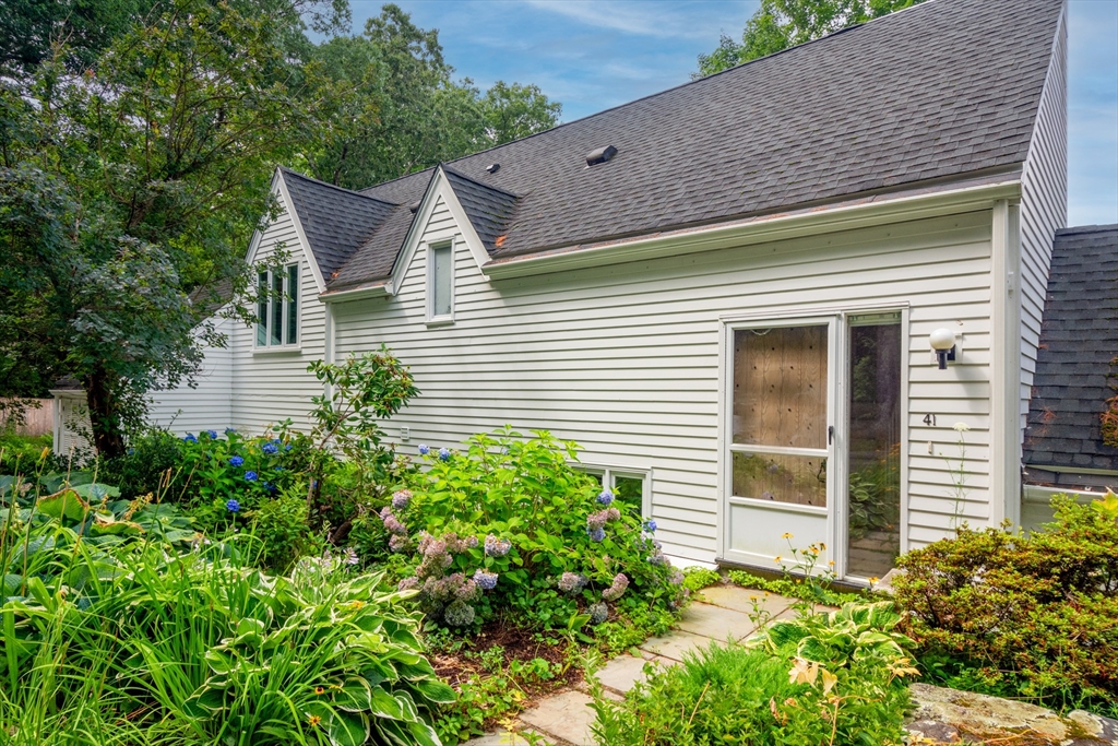 41 Todd Pond Road, Unit 41 Lincoln, MA 01773 - Photo 1 of 26 a view of a house with brick walls and potted plants