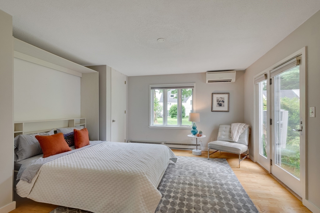 41 Todd Pond Road, Unit 41 Lincoln, MA 01773 - Photo 13 of 26 a bedroom with bed couch and window