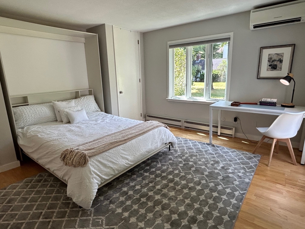 41 Todd Pond Road, Unit 41 Lincoln, MA 01773 - Photo 14 of 26 a bedroom with a bed and a window