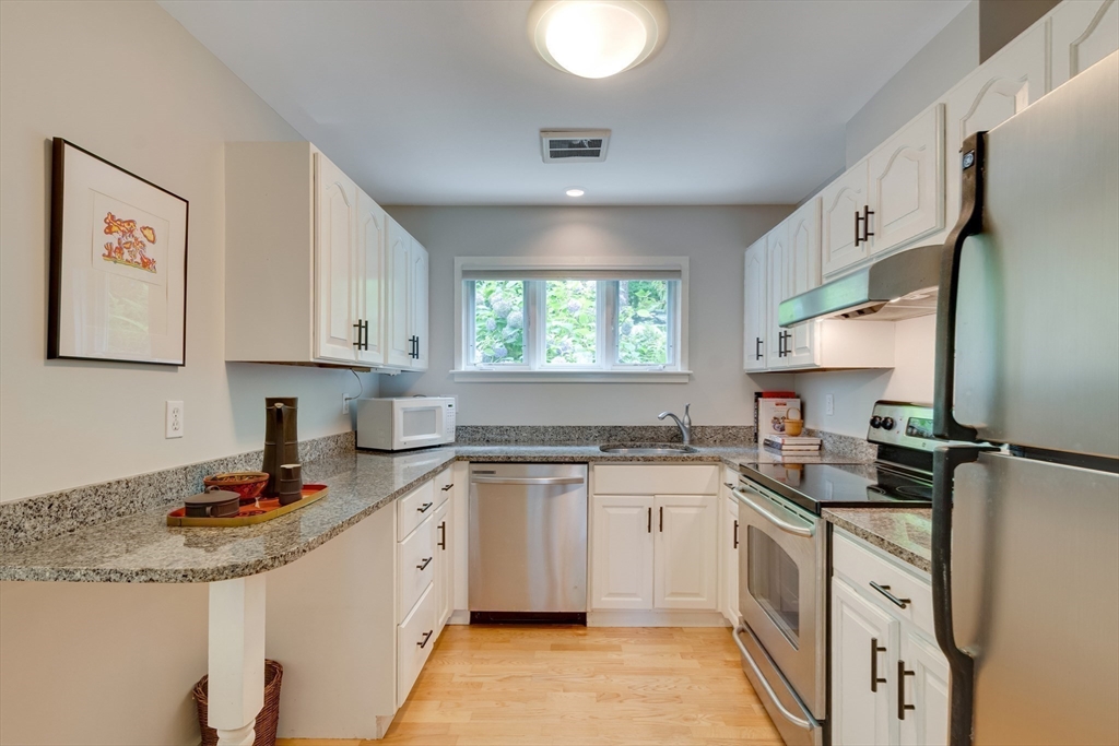41 Todd Pond Road, Unit 41 Lincoln, MA 01773 - Photo 16 of 26 a kitchen with a sink stove and cabinets