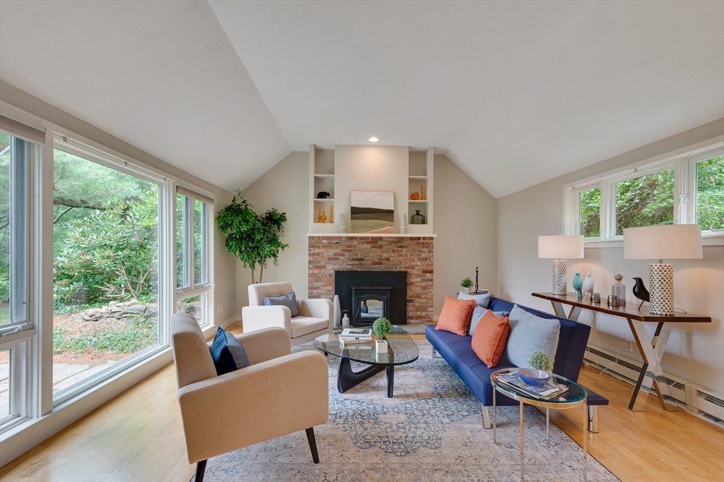 41 Todd Pond Road, Unit 41 Lincoln, MA 01773 - Photo 2 of 26 a living room with furniture and a fireplace