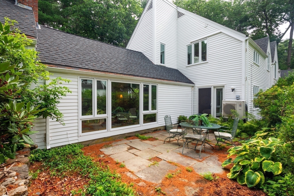 41 Todd Pond Road, Unit 41 Lincoln, MA 01773 - Photo 24 of 26 a view of house with backyard and outdoor seating