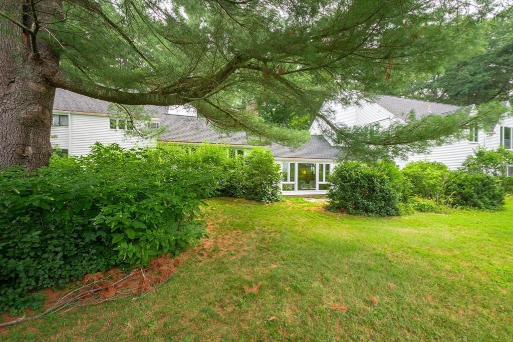 41 Todd Pond Road, Unit 41 Lincoln, MA 01773 - Photo 25 of 26 a front view of a house with garden