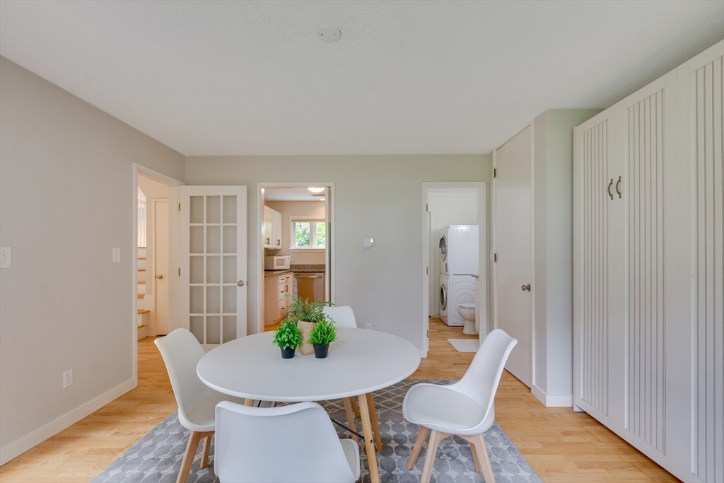 41 Todd Pond Road, Unit 41 Lincoln, MA 01773 - Photo 3 of 26 a view of a dining room with furniture and wooden floor